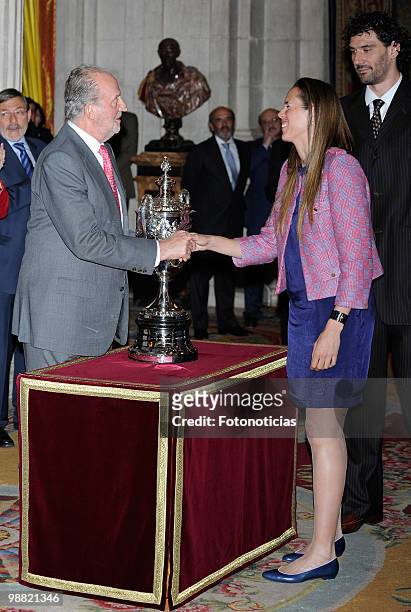 King Juan Carlos of Spain delivers a National Sport award to basketball players Amaya Valdemoro and Jorge Garbajosa , during the 'National Sports...
