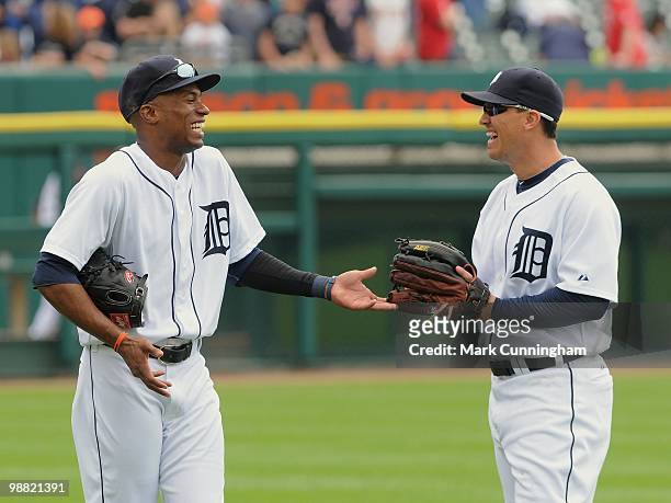 Austin Jackson and Magglio Ordonez of the Detroit Tigers share a laugh together in the outfield before the game against the Los Angeles Angels of...