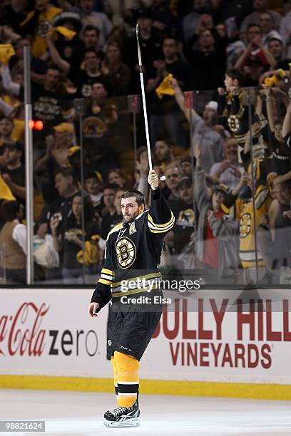 Patrice Bergeron of the Boston Bruins salutes the fans after the game against the Philadelphia Flyers in Game One of the Eastern Conference...