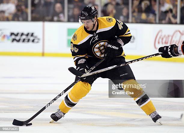 David Krejci of the Boston Bruins takes the puck against the Philadelphia Flyers in Game One of the Eastern Conference Semifinals during the 2010 NHL...