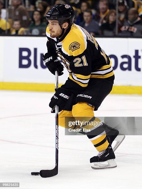 Andrew Ference of the Boston Bruins takes the puck against the Philadelphia Flyers in Game One of the Eastern Conference Semifinals during the 2010...