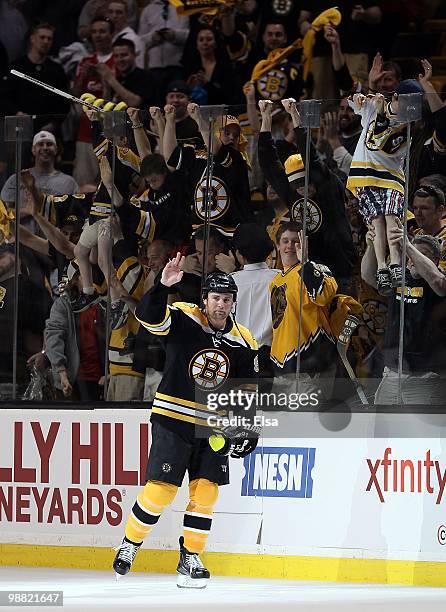 Marc Savard of the Boston Bruins salutes the cheering fans after the game against the Philadelphia Flyers in Game One of the Eastern Conference...