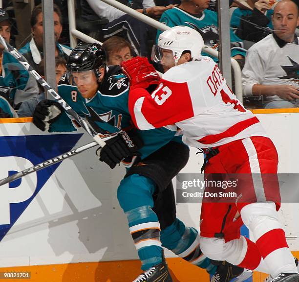 Pavel Datsyuk of the Detroit Red Wings and Joe Pavelski of the San Jose Sharks battle for the puck in Game One of the Western Conference Semifinals...