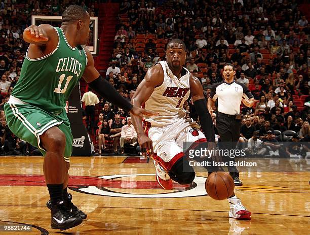 Dwyane Wade of the Miami Heat drives to the basket against Glen Davis of the Boston Celtics in Game Four of the Eastern Conference Quarterfinals...