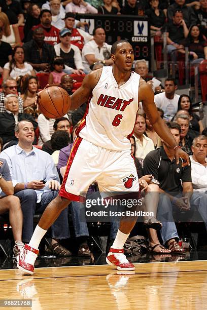 Mario Chalmers of the Miami Heat looks to make a move in Game Four of the Eastern Conference Quarterfinals against the Boston Celtics during the 2010...