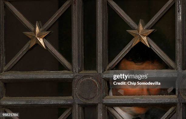 Anthony Hayward peers out a window before leaving the U.S. Department of the Interior May 3, 2010 in Washington, DC. Hayward and other BP executives...