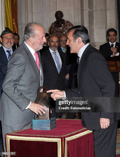 King Juan Carlos of Spain delivers a lifetime achievement award to former golf player Severiano Ballesteros, during the 'National Sports Awards' 2009...