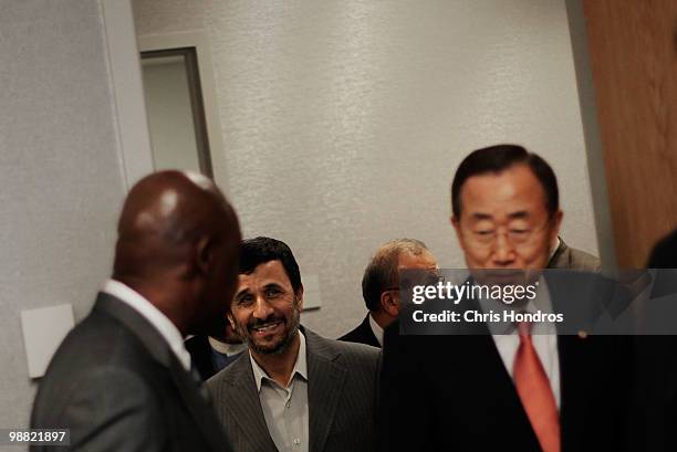 Iranian president Mahmoud Ahmadinejad walks in with United Nations Secretary General Ban Ki-Moon for a meeting during the Nuclear Non- Proliferation...