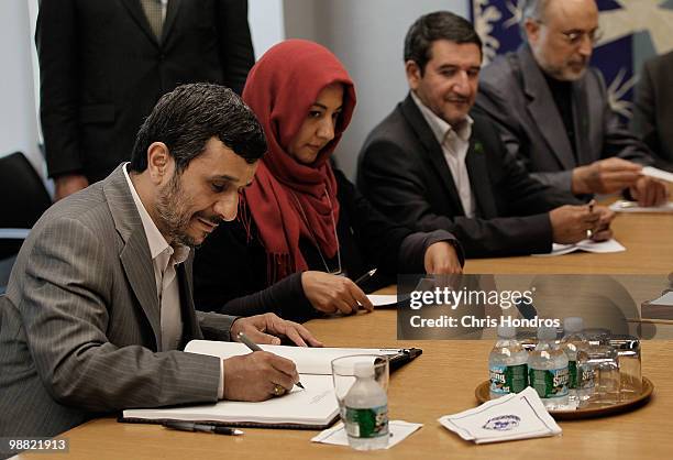 Iranian president Mahmoud Ahmadinejad signs the guest book of United Nations Secretary General Ban Ki-Moon during the Nuclear Non- Proliferation...