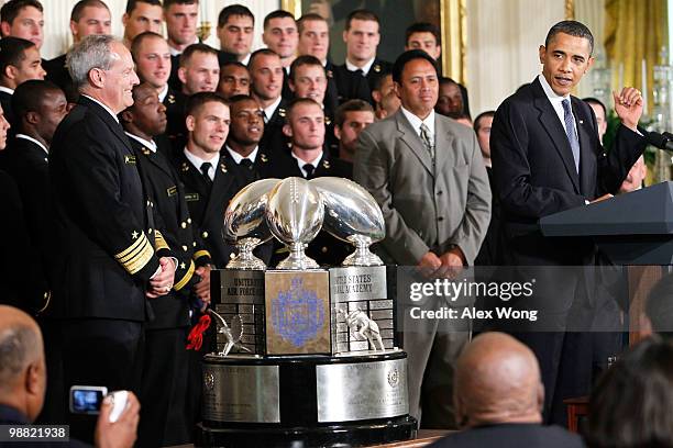 President Barack Obama speaks as he hosts members of the Navy football team Midshipmen during the presentation ceremony of the Commander-in-Chief's...