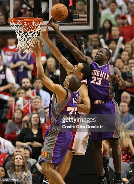 Brandon Roy of the Portland Trail Blazers rebounds against Jason Richardson and Grant Hill of the Phoenix Suns during Game Six of the Western...