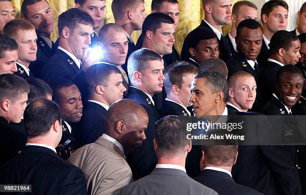 President Barack Obama greets members of the Navy football team Midshipmen during the presentation ceremony of the Commander-in-Chief's Trophy at the...