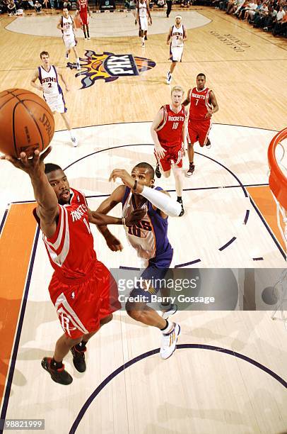 Aaron Brooks of the Houston Rockets makes a layup against Leandro Barbosa of the Phoenix Suns during the game at U.S. Airways Center on April, 2010...