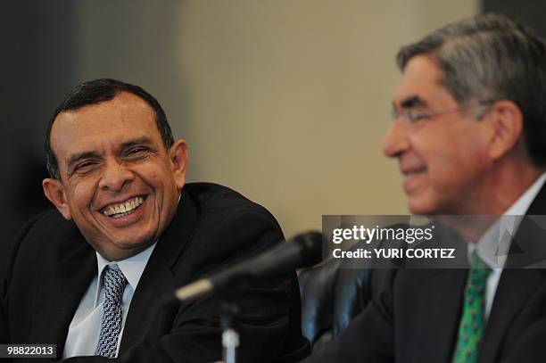 Honduran President Porfirio Lobo smiles next to his Costa Rican counterpart, Oscar Arias during a press conference at the Presidential Palace on May...