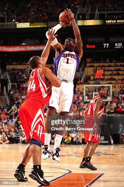 Amar'e Stoudemire of the Phoenix Suns makes a jumpshot against Chuck Hayes of the Houston Rockets during the game at U.S. Airways Center on April,...
