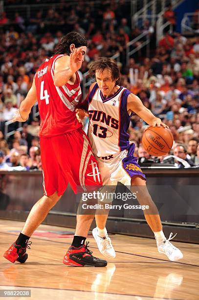 Steve Nash of the Phoenix Suns drives the ball against Luis Scola of the Houston Rockets during the game at U.S. Airways Center on April, 2010 in...