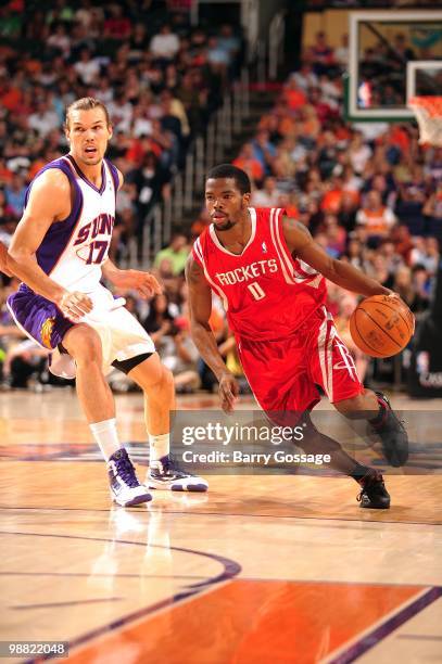 Aaron Brooks of the Houston Rockets drives the ball against Louis Amundson of the Phoenix Suns during the game at U.S. Airways Center on April, 2010...