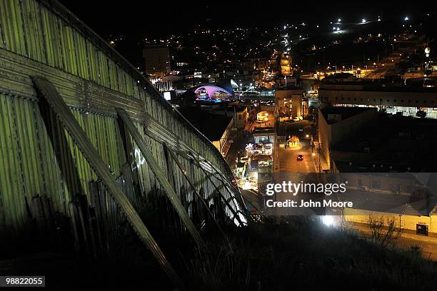 The border fence slopes down between the United States and Mexico on May 2, 2010 in Nogales, Arizona. Although the U.S. Government has spent billions...