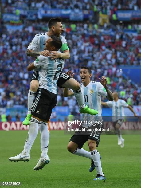 Gabriel Mercado of Argentina celebrates after scoring his team's second goal with team mates Lionel Messi and Angel Di Maria during the 2018 FIFA...