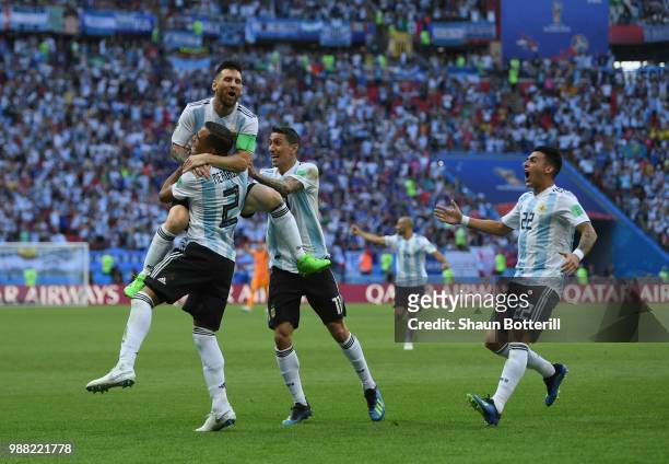Gabriel Mercado of Argentina celebrates after scoring his team's second goal with team mates Lionel Messi;Angel Di Maria and Cristian Pavon during...