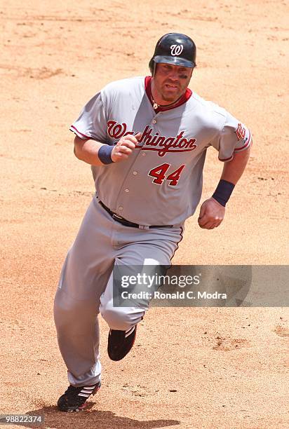 Adam Dunn of the Washington Nationals runs to third base during a MLB game against the Florida Marlins in Sun Life Stadium on May 2, 2010 in Miami,...