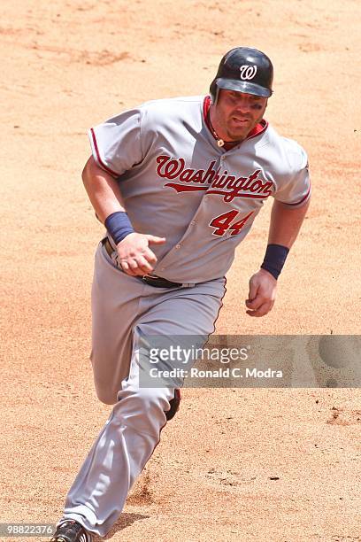 Adam Dunn of the Washington Nationals runs to third base during a MLB game against the Florida Marlins in Sun Life Stadium on May 2, 2010 in Miami,...