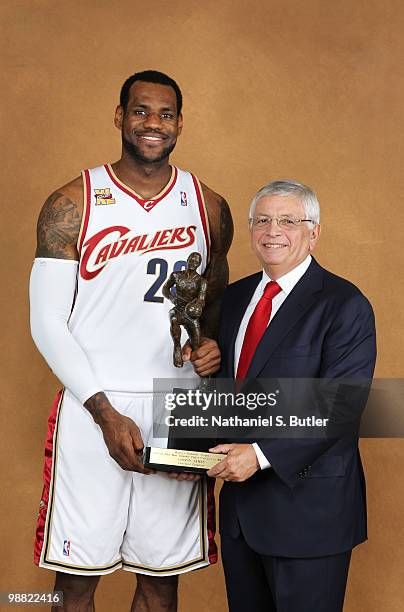 LeBron James of the Cleveland Cavaliers poses with NBA Commissioner David Stern prior to receiving the Maurice Podoloff Trophy in recognition for...