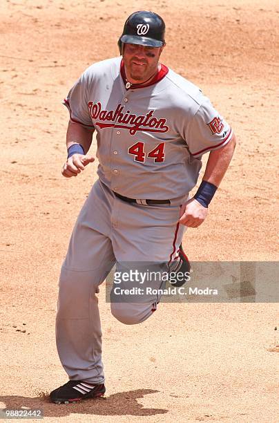 Adam Dunn of the Washington Nationals runs to third base during a MLB game against the Florida Marlins in Sun Life Stadium on May 2, 2010 in Miami,...