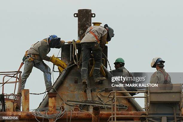 Welders at work on the Pollution Control Dome being built by steelworkers at the Martin Terminal worksite in Port Fourchon, as BP rushes to cap the...