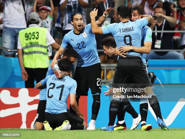 Matias Vecino of Uruguay congratulates Edinson Cavani of Uruguay on his goal during the 2018 FIFA World Cup Russia Round of 16 match between Uruguay...