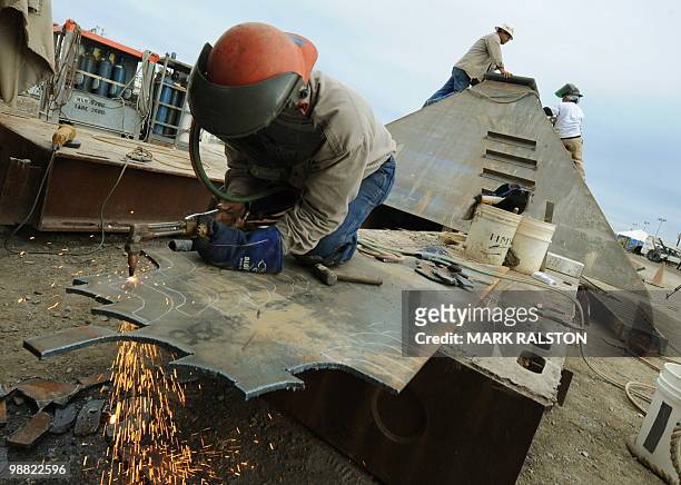 Welders at work on the Pollution Control Dome being built at the Martin Terminal worksite in Port Fourchon, as BP rushes to cap the source of the oil...