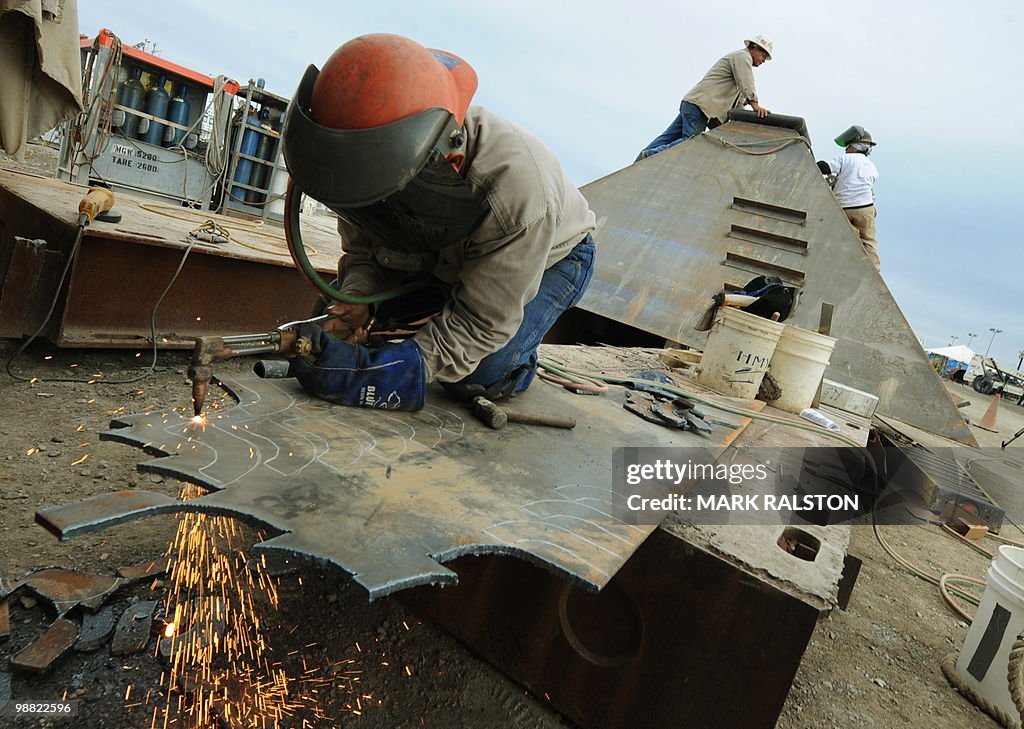 Welders at work on the Pollution Control