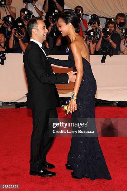 Designer Francisco Costa and actress Zoe Saldana attend the Costume Institute Gala Benefit to celebrate the opening of the "American Woman:...