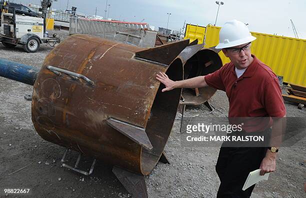 An engineer next to the top hats used to connect a pipeline to the Pollution Control Dome being built at the Martin Terminal worksite in Port...