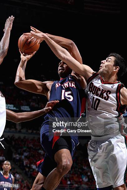 Al Horford of the Atlanta Hawks goes up for a shot against Carlos Delfino of the Milwaukee Bucks in Game Six of the Eastern Conference Quarterfinals...