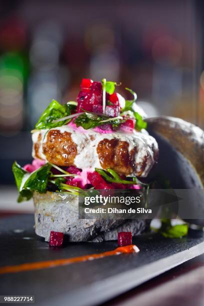 lamb burger together with a squid ink bun - squid ink stock pictures, royalty-free photos & images