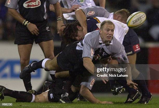 Brad Macleod-Henderson of the Sharks gets a pass away during the Super 12 Grand Final between the ACT Brumbies and the Sharks at Bruce Stadium,...