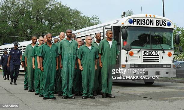 Prisoners from the Elayn Hunt Correctional Center line up as they prepare to undertake a training exercise to learn how to cleanse oil from birds...