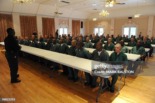 Prisoners from the Elayn Hunt Correctional Center undertake a training exercise to learn how to cleanse oil from birds affected by the oil slick from...