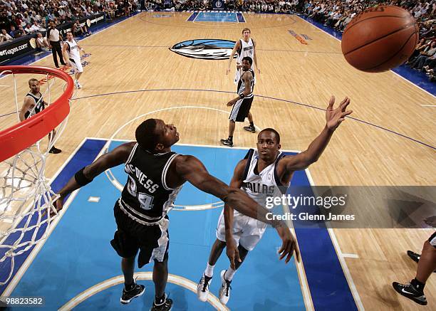 Rodrigue Beaubois of the Dallas Mavericks shoots a layup against Antonio McDyess of the San Antonio Spurs during the game at American Airlines Center...