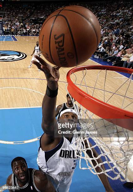 Brendan Haywood of the Dallas Mavericks shoots a layup against DeJuan Blair of the San Antonio Spurs during the game at American Airlines Center on...