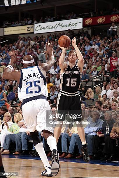 Matt Bonner of the San Antonio Spurs shoots a jump shot against Erick Dampier of the Dallas Mavericks during the game at American Airlines Center on...