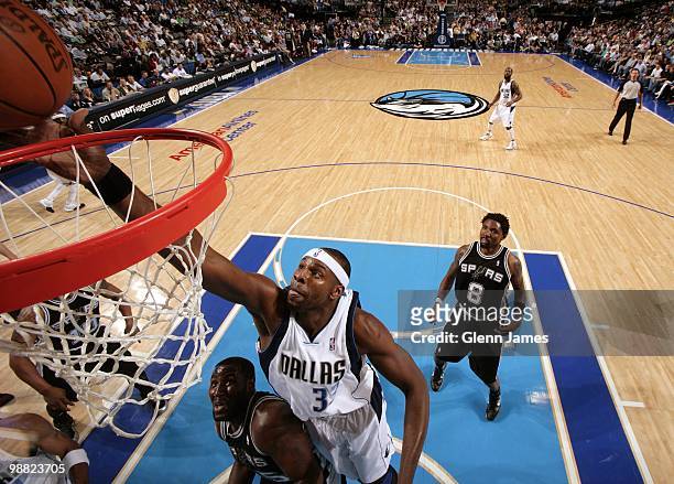 Brendan Haywood of the Dallas Mavericks shoots a layup over DeJuan Blair of the San Antonio Spurs during the game at American Airlines Center on...
