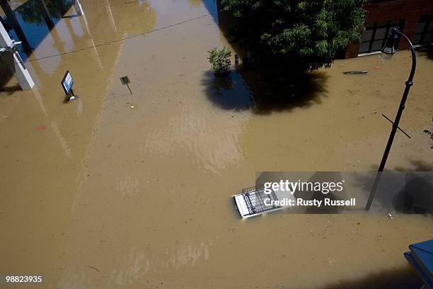 An SUV sits submerged in floodwaters covering downtown streets and sidewalks May 3, 2010 in the Lower Broad district of Nashville, Tennessee. More...