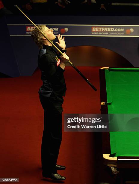 Neil Robertson of Australia celebrates beating Graeme Dott of Scotland to win the Betfred.com World Snooker Championships at The Crucible Theatre on...
