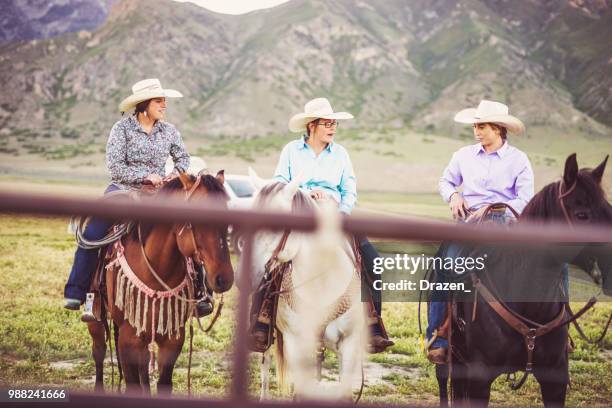 three cowgirls riding horses in nature - western dressage stock pictures, royalty-free photos & images