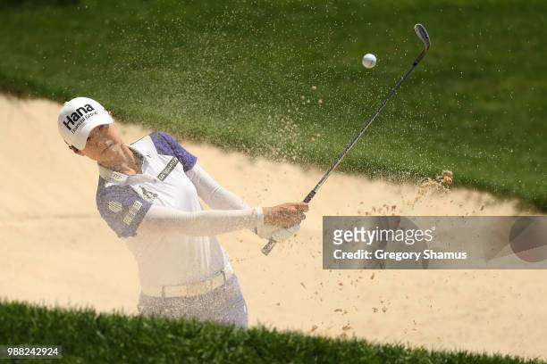 Sung Hyun Park of Korea hits from a green side sand trap to the third green during the final round of the 2018 KPMG PGA Championship at Kemper Lakes...