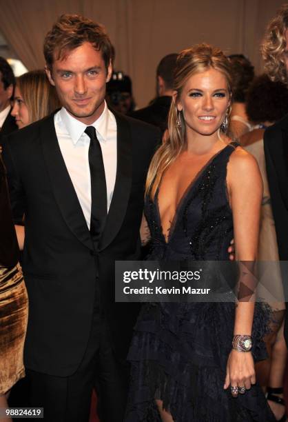 Jude Law and Sienna Miller attends the Costume Institute Gala Benefit to celebrate the opening of the "American Woman: Fashioning a National...