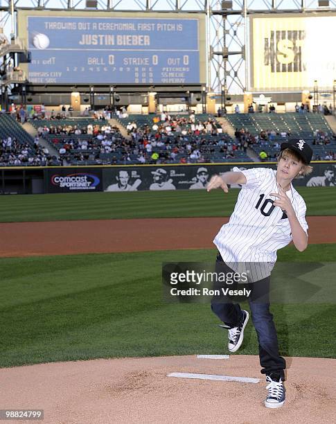 Pop star Justin Bieber throws out a ceremonial first pitch prior to the game between the Chicago White Sox and Kansas City Royals on May 3, 2010 at...