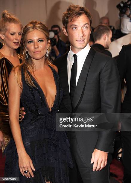 Sienna Miller and Jude Law attends the Costume Institute Gala Benefit to celebrate the opening of the "American Woman: Fashioning a National...